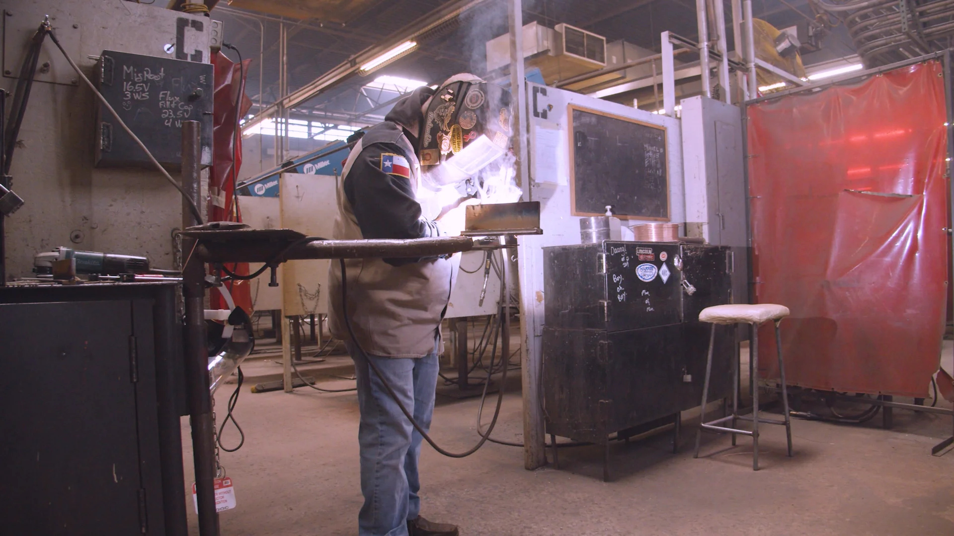 Students collaborating over technology equipment