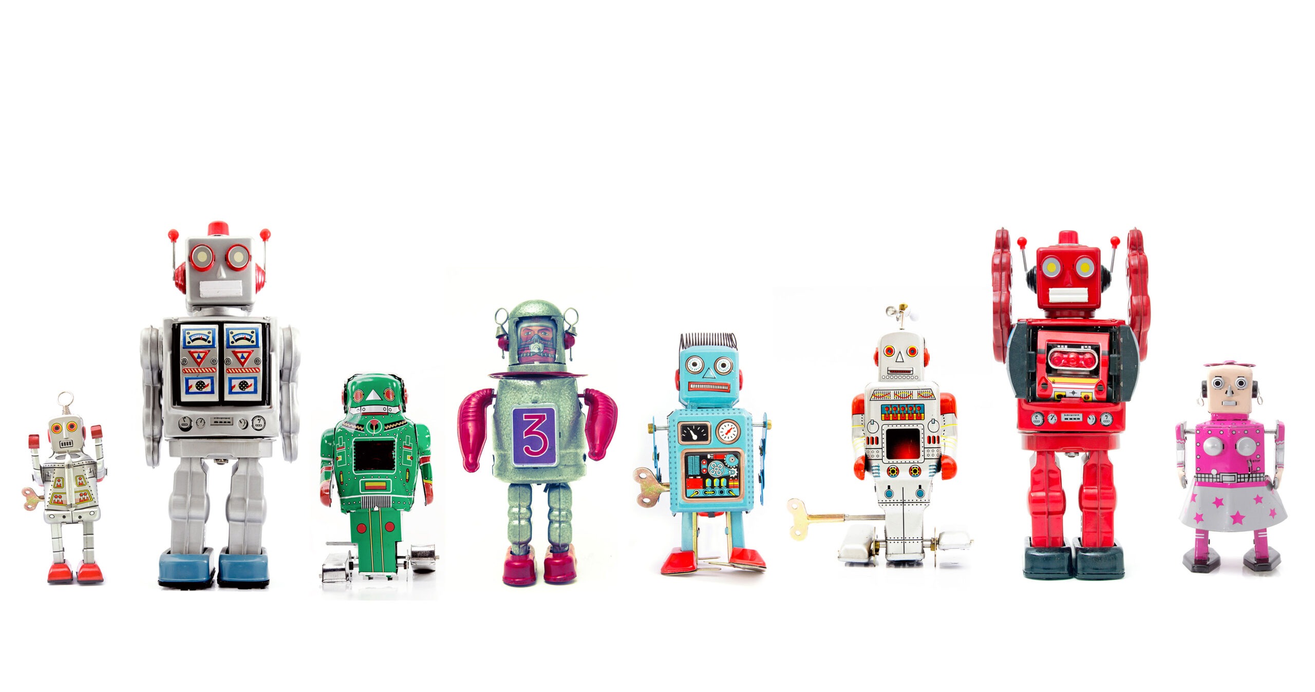 Robot toys lined up in a row in a white background.