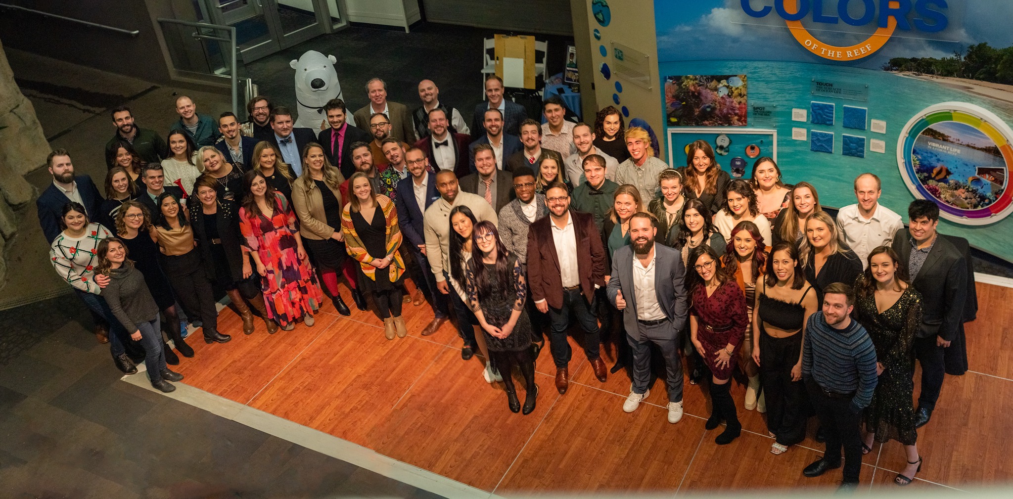 Level Agency team holiday party photo, featuring the full staff and someone in a polar bear costume.