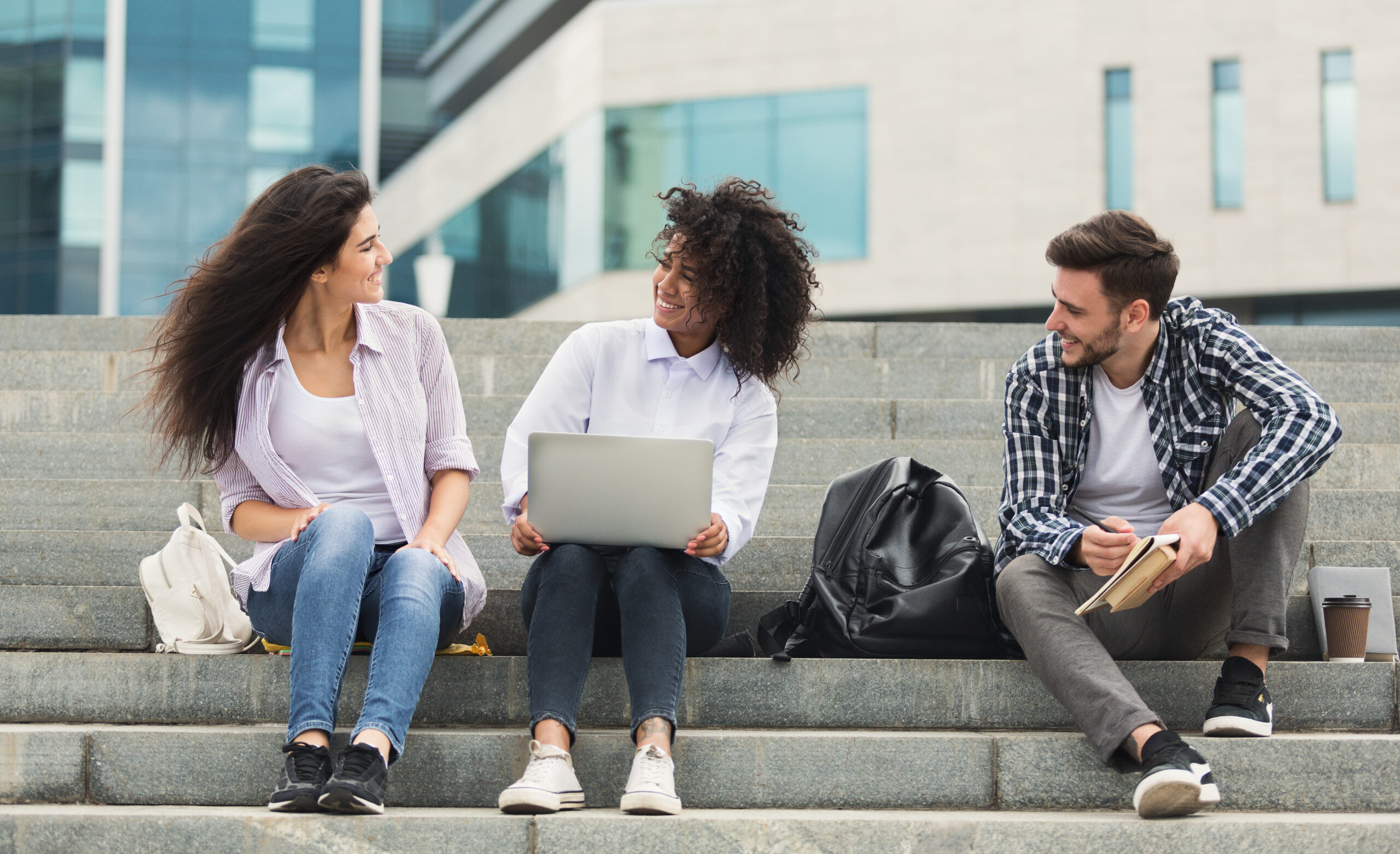 college students talking on steps