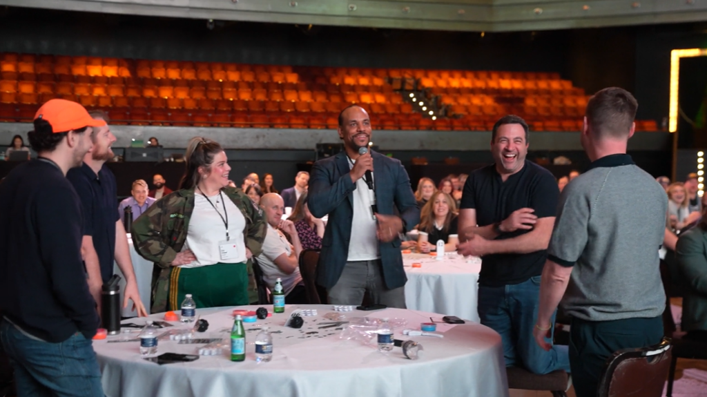 Level Agency and BAM Strategy team members laughing together during a group activity at the All In Summit