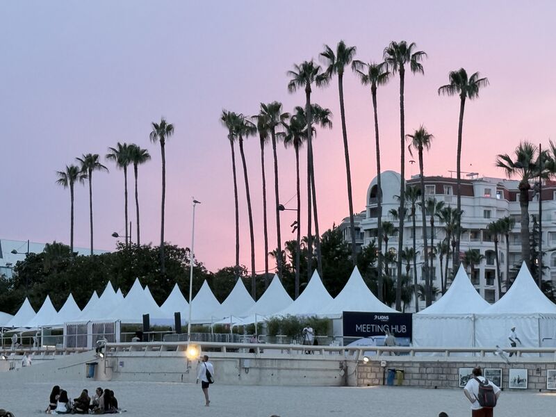 Cannes Lions 2026 festival tents and Meeting Hub along the Croisette beachfront at dusk